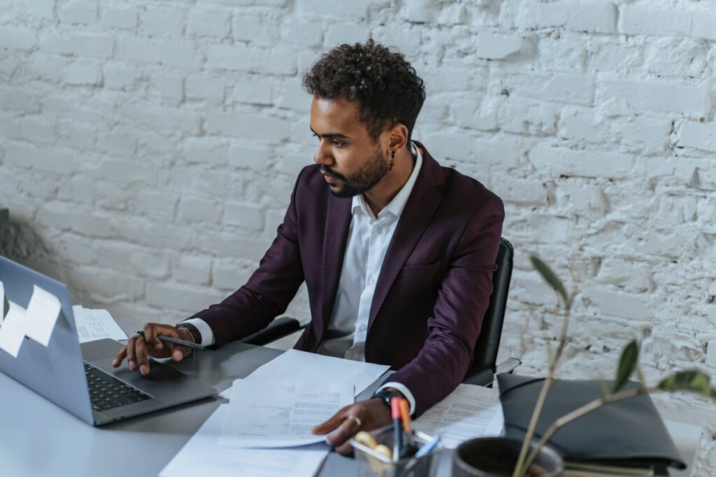 Professional reviewing information on a laptop, illustrating how LinkedIn authority signals shape perception quickly
