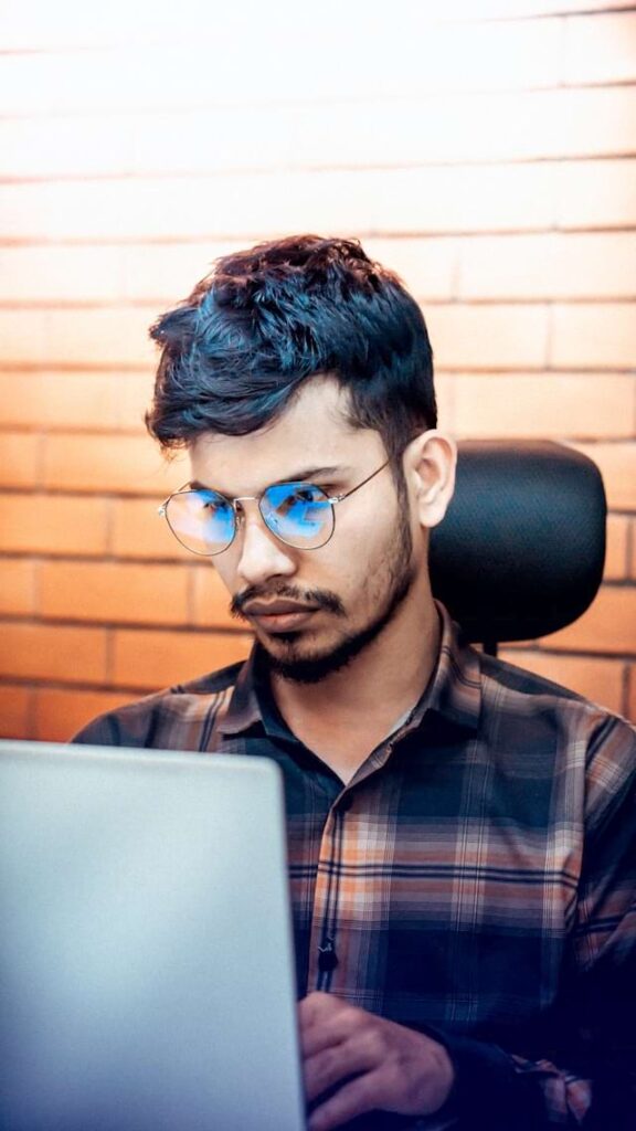 Professional experiencing LinkedIn comparison discomfort while reviewing another profile