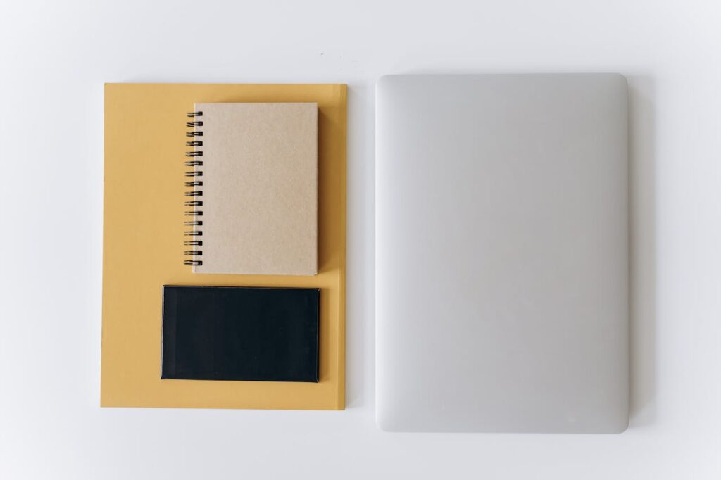 Organized workspace with laptop and notebook representing structured LinkedIn profile and clear authority signals