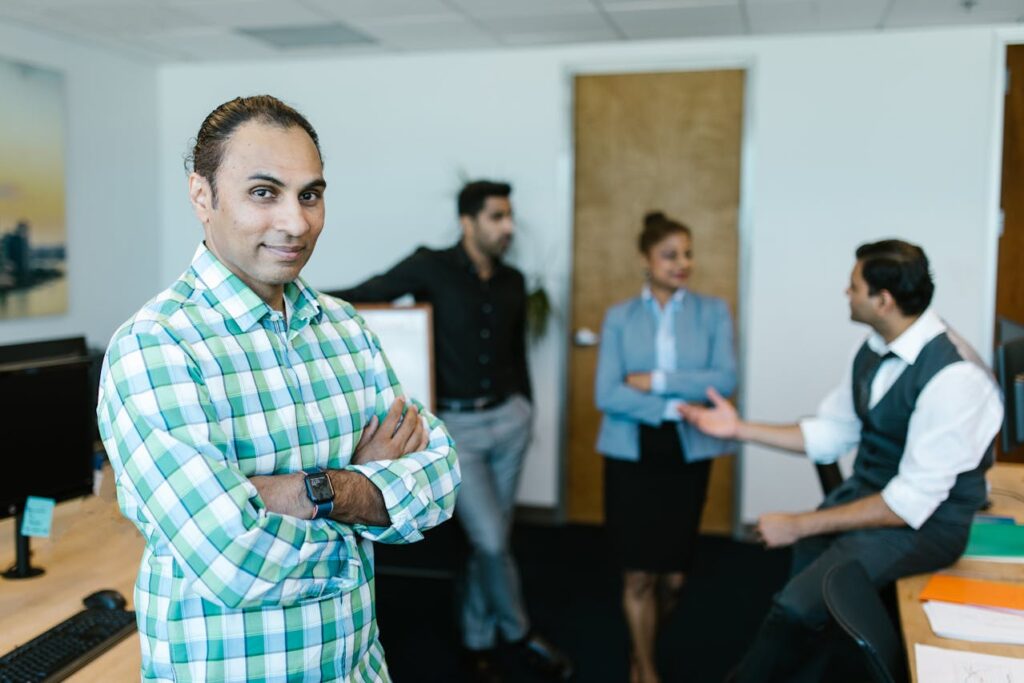 Confident professional in focus while others in the background are blurred, highlighting distinction