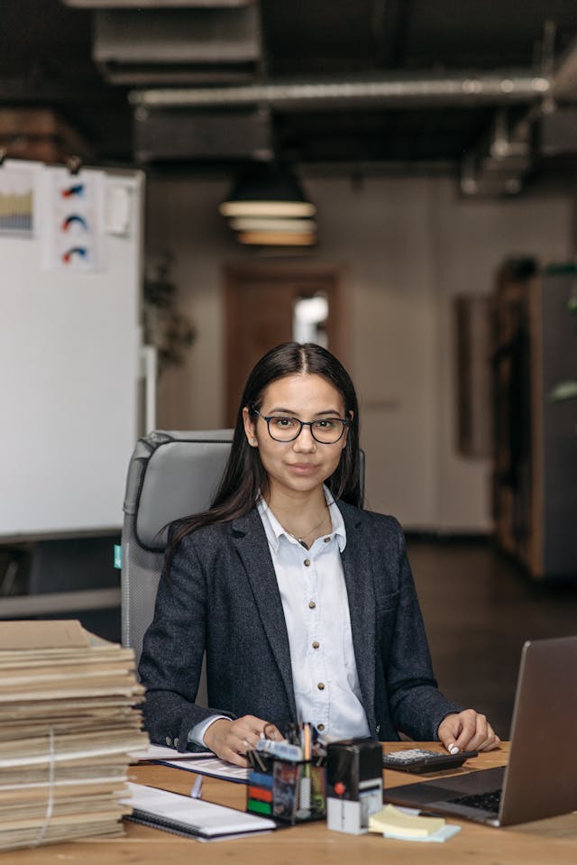 Professional working at an office desk in a modern corporate environment