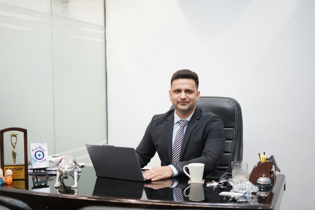 Senior corporate professional working at a desk in a formal office setting