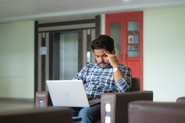 Professional reviewing a LinkedIn profile before a business meeting, demonstrating LinkedIn relevance.